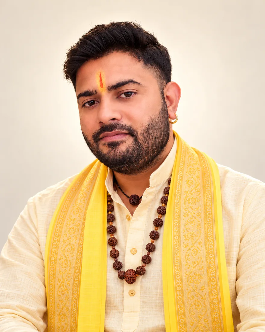 Pandit Ankush Ji in a yellow ceremonial shawl
